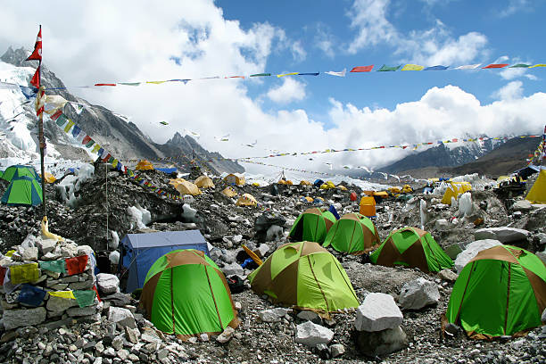 Colorful tents and Tibetan prayer flags at Everest Base Camp, Khumbu Region, Nepal.