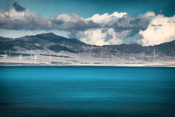 An array of windmills standing alone the Sayram Lake (Sailimu Hu) in Xinjiang, China